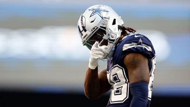 Cowboys wide receiver CeeDee Lamb points to the photographer.